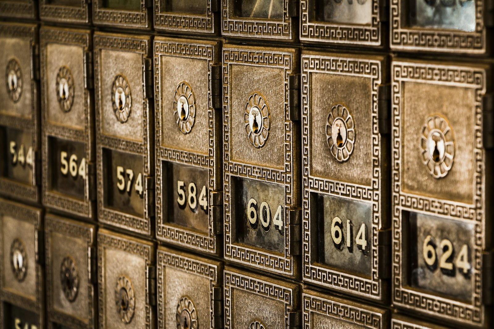 A wall of metal safe deposit boxes in a bank